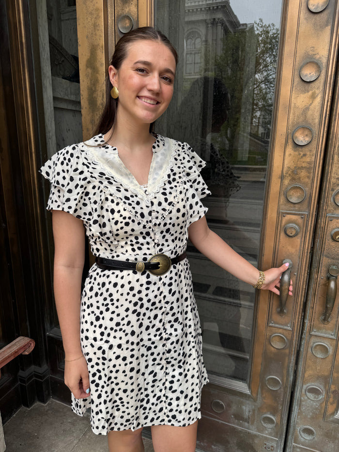 Stylish woman in a Ruffled Animal Polka Dot Print Button-Up Dress for Women, perfect for any occasion.