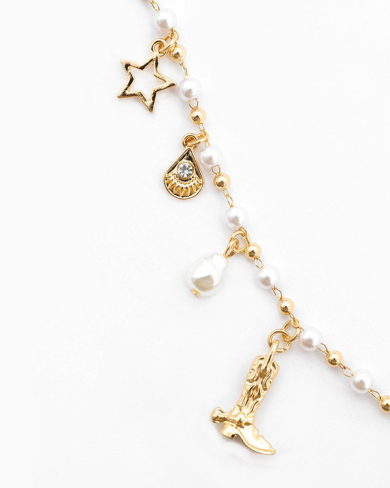 side angle close up view of charms on necklace 