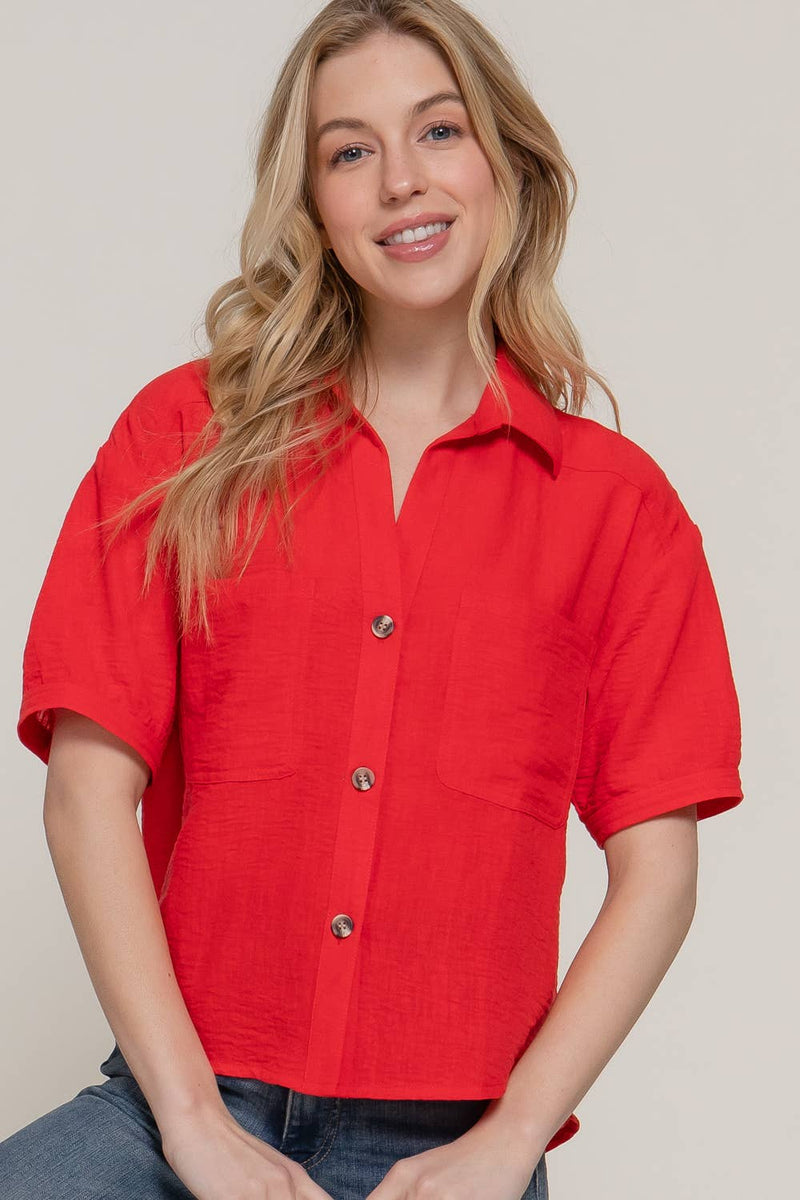 Front view of the Short Sleeve Notched Linen Effect Shirt in Red – A vibrant red button-up shirt featuring a notched collar and lightweight linen-textured fabric.

