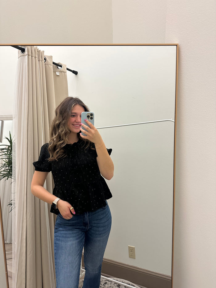 Stylishly wearing the Black Rhinestone Dotted Tie-Front Blouse for Elegant Style, perfect for any occasion.