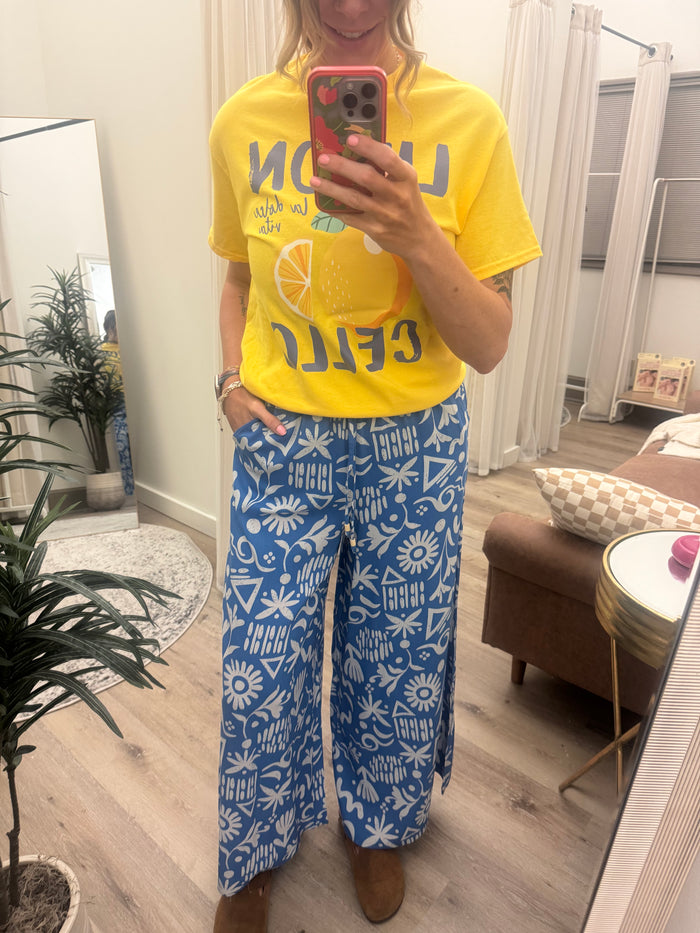 Plus Size Printed Wide Leg Long Pants with Side Pockets and Ruffled Elastic Waist with Drawstring High Waist