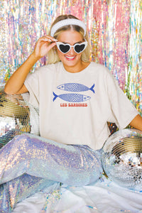 Close-up of the sardines print artwork on a cotton oversized t-shirt.

